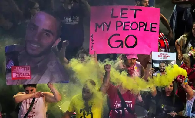 People take part in a protest demanding the end of the war and immediate release of hostages held by Hamas in the Gaza Strip, and against Prime Minister Benjamin Netanyahu's government, in Tel Aviv, Saturday, May 31, 2025. (AP Photo/Ariel Schalit)