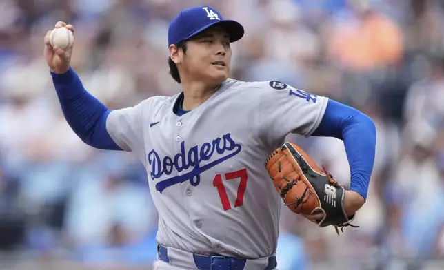 Los Angeles Dodgers starting pitcher Shohei Ohtani throws during the first inning of a baseball game against the Kansas City Royals, Saturday, June 28, 2025, in Kansas City, Mo. (AP Photo/Charlie Riedel)