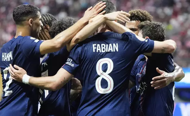 Paris Saint-Germain team celebrates the second goal by Paris Saint-Germain's Joao Neves during the Club World Cup round of 16 soccer match between PSG and Inter Miami in Atlanta, Sunday, June 29, 2025. (AP Photo/Mike Stewart)