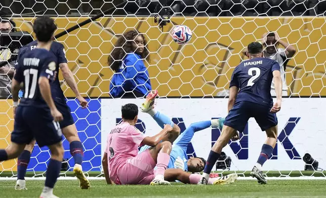 Paris Saint-Germain's Achraf Hakimi, right, scores his side's fourth goal during the Club World Cup round of 16 soccer match between PSG and Inter Miami in Atlanta, Sunday, June 29, 2025. (AP Photo/Brynn Anderson)