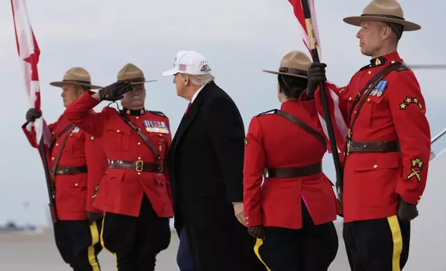 President Donald Trump arrives on Air Force One at Calgary International Airport, Sunday, June 15, 2025, in Calgary, Canada, ahead of the G7 Summit. (AP Photo/Mark Schiefelbein)
