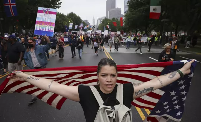 Demonstrators march down Benjamin Franklin Parkway during the "No Kings" protest, Saturday, June 14, 2025, in Philadelphia. (AP Photo/Yuki Iwamura)