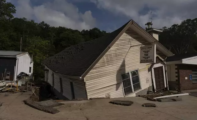 The Valley Grove Assembly of God, twisted and moved from its foundation by floodwaters, is seen Monday, June 16, 2025, in Valley Grove, W.Va. (AP Photo/Carolyn Kaster)