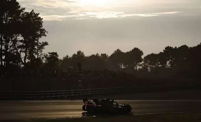 A car race during the 24-hour Le Mans endurance race, Saturday June 14, 2025 in Le Mans, western France. (AP Photo/Jeremias Gonzalez)