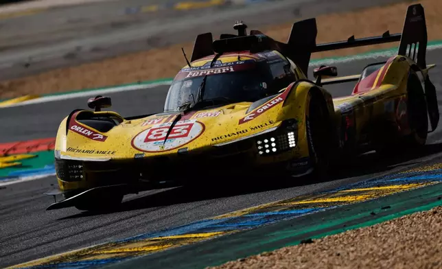 AF Corse car (starting no. 83) a Ferrari 499P with Robert Kubica of Poland, Yifei Ye of China and Phil Hanson of Great Britain takes a curve during the 24-hour Le Mans endurance race, Sunday June 15, 2025 in Le Mans, western France. (AP Photo/Jeremias Gonzalez)