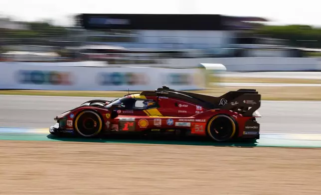Ferrari AF Corse car (starting no. 51) a Ferrari 499P with Alessandro Pier Guidi of Italy, James Calado of Great Britain and Antonio Giovinazzi of Italy races during the 24-hour Le Mans endurance race, Sunday June 15, 2025 in Le Mans, western France. (AP Photo/Jeremias Gonzalez)