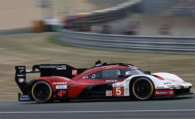 Porsche Penske Motorsport car (starting no. 5) a Porsche 963 with Julien Andlauer of France, Michael Christensen of Denmark and Mathieu Jaminet of France races during the 24-hour Le Mans endurance auto race, Saturday June 14, 2025 in Le Mans, western France. (AP Photo/Jeremias Gonzalez)