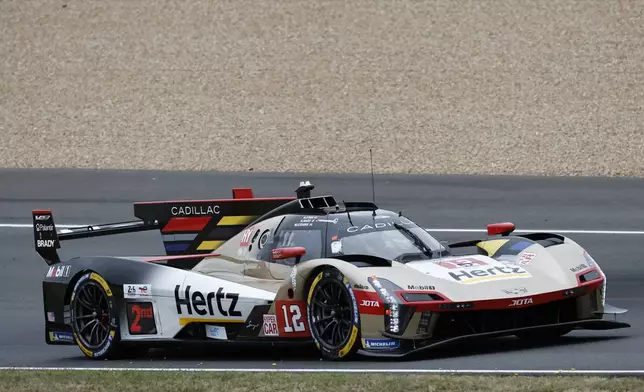 Cadillac Hertz Team JOTA car (starting no. 12) a Cadillac V‑Series.R with Will Stevens of Great Britain, Norman Nato of France and Alex Lynn of Great Britain races duringt he 24-hour Le Mans endurance auto race, Saturday June 14, 2025 in Le Mans, western France. (AP Photo/Jeremias Gonzalez)
