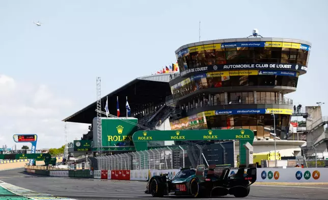 Aston Martin THOR Team car (starting no. 007) an Aston Martin Valkyrie with Harry Tincknell of Great Britain, Tom Gamble of Great Britain and Ross Gunn of Great Britain races during the 24-hour Le Mans endurance race, Sunday June 15, 2025 in Le Mans, western France. (AP Photo/Jeremias Gonzalez)