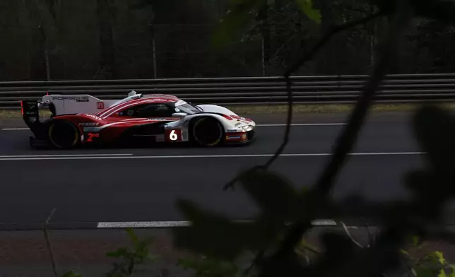 Porsche Penske Motorsport car (No. 6) a Porsche 963 with Kevin Estre of France, Laurens Vanthoor of Belgium and Matt Campbell of Australia races during the 24-hour Le Mans endurance race, Saturday June 14, 2025 in Le Mans, western France. (AP Photo/Jeremias Gonzalez)