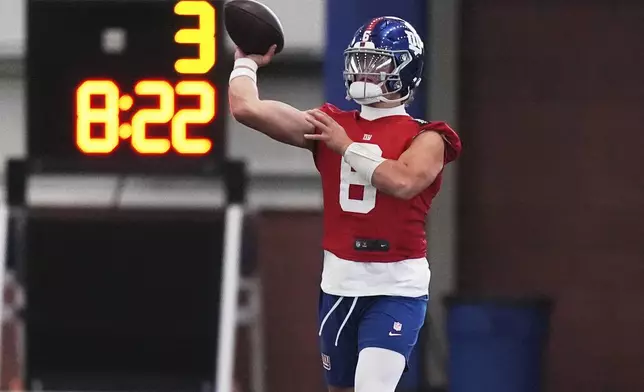 New York Giants quarterback Jaxson Dart throws a pass during an NFL football practice, Wednesday, June 18, 2025, in East Rutherford, N.J. (AP Photo/Frank Franklin II)