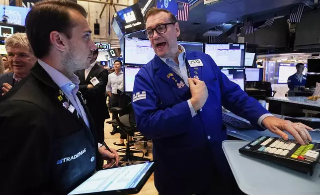 Trader Dylan Halvorsan, left, and specialist Patrick King work on the floor of the New York Stock Exchange, Thursday, June 5, 2025. (AP Photo/Richard Drew)