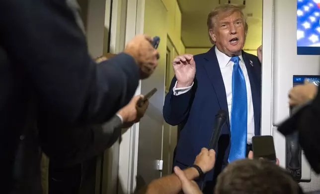 President Donald Trump speaks with reporters while flying aboard Air Force One en route from Calgary, Canada to Joint Base Andrews, Md., late Monday, June 16, 2025. (AP Photo/Mark Schiefelbein)