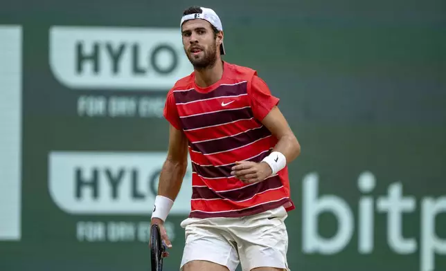 Russia's Karen Khachanov reacts as he plays Kazakhstan's Alexander Bublik during their men's singles semifinal, at the Halle tennis tournament, Germany, Saturday, June 21, 2025. (David Inderlied/dpa via AP)