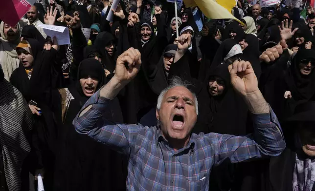 People chant slogans during a protest to condemn Israeli attacks on multiple cities across Iran, after the Friday prayers ceremony in Tehran, Iran, Friday, June 20, 2025. (AP Photo/Vahid Salemi)