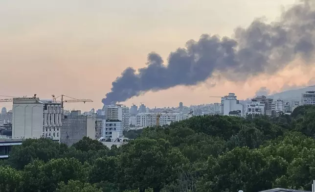 Smoke rises from the building of Iran's state-run television after an Israeli strike in Tehran, Iran, Monday, June 16, 2025. (AP Photo)