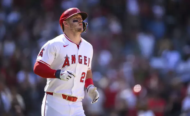 Los Angeles Angels' Mike Trout reacts after hitting a fly ball to end the game iin the ninth inning of a baseball game against the Houston Astros, Sunday, June 22, 2025, in Anaheim, Calif. (AP Photo/William Liang)