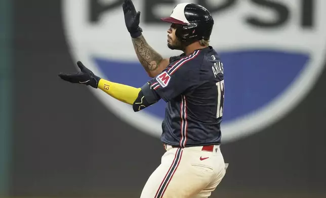 Cleveland Guardians' Gabriel Arias gestures from second base after hitting a double in the seventh inning of a baseball game against the Houston Astros in Cleveland, Friday, June 6, 2025. (AP Photo/Sue Ogrocki)