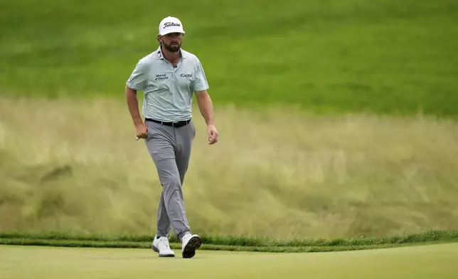Cameron Young walks up the fifth fairway during the final round of the U.S. Open golf tournament at Oakmont Country Club Sunday, June 15, 2025, in Oakmont, Pa. (AP Photo/Seth Wenig)