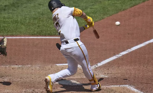 Pittsburgh Pirates' Spencer Horwitz doubles off Texas Rangers pitcher Caleb Boushley, driving in two runs, during the fifth inning of a baseball game in Pittsburgh, Sunday, June 22, 2025. (AP Photo/Gene J. Puskar)