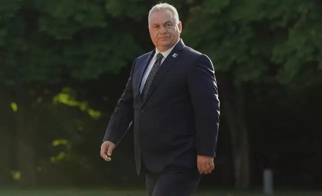 Hungary's Prime Minister Viktor Orban arrives for a formal dinner at the Paleis Huis ten Bosch ahead of the NATO summit in The Hague, Netherlands, Tuesday, June 24, 2025. (AP Photo/Markus Schreiber)