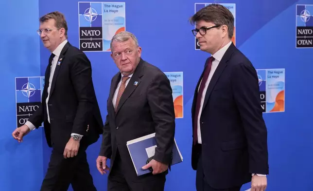 Denmark's Foreign Minister Lars Lokke Rasmussen, center, arrives for the NATO summit in The Hague, Netherlands, Wednesday, June 25, 2025. (AP Photo/Matthias Schrader)