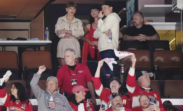 Singer Taylor Swift, top left, takes in the third period in Game 4 of the NHL hockey Stanley Cup Final between the Edmonton Oilers and the Florida Panthers in Sunrise, Fla., Thursday, June 12, 2025. (Nathan Denette/The Canadian Press via AP)