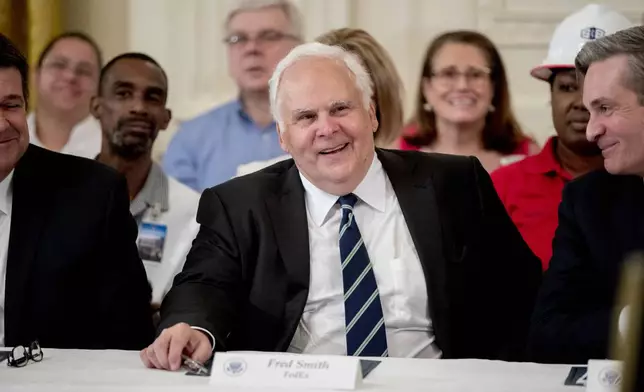 FILE - FedEx CEO Fred Smith appears at a signing ceremony where President Donald Trump signed an Executive Order that establishes a National Council for the American Worker in the East Room of the White House, Thursday, July 19, 2018, in Washington. (AP Photo/Andrew Harnik, File)
