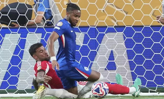 Chelsea's Christopher Nkunku scores his teams second goal during the Club World Cup round of 16 soccer match between Benfica and Chelsea in Charlotte, N.C., Saturday, June 28, 2025. (AP Photo/Chris Carlson)