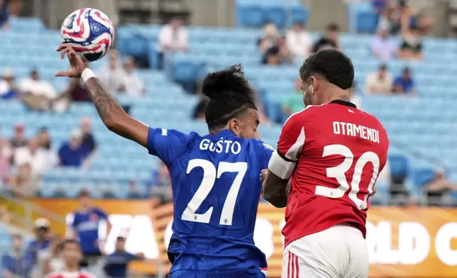Chelsea's Malo Gusto is called for a hand ball against Benfica's Nicolas Otamendi during the Club World Cup round of 16 soccer match between Benfica and Chelsea in Charlotte, N.C., Saturday, June 28, 2025. (AP Photo/Chris Carlson)