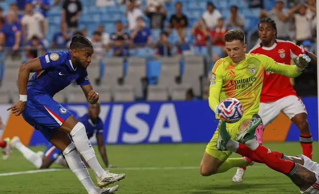 Chelsea's Christopher Nkunku scores his side's second goal against Benfica during the Club World Cup round of 16 soccer match between Benfica and Chelsea in Charlotte, N.C., Saturday, June 28, 2025. (AP Photo/Nell Redmond)