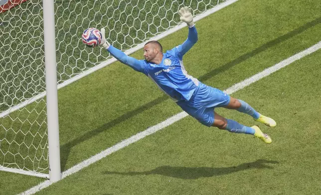 Palmeiras' goalkeeper Weverton makes a save during the Club World Cup round of 16 soccer match between Palmeiras and Botafogo in Philadelphia, Saturday, June 28, 2025. (AP Photo/Chris Szagola)