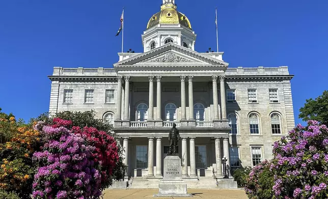 FILE - Flowers bloom outside the New Hampshire Statehouse on June 1, 2024, in Concord, N.H. (AP Photo/Holly Ramer, file)
