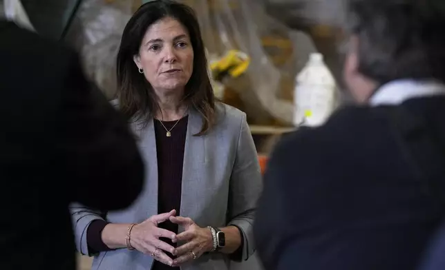 FILE-Kelly Ayotte speaks with Manchester, N.H. businessmen in this Oct. 16, 2024 file photo. (AP Photo/Charles Krupa)