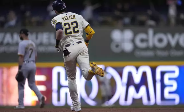 Milwaukee Brewers' Christian Yelich (22) rounds the bases after hitting a two-run home run during the fifth inning of a baseball game against the Pittsburgh Pirates, Monday, June 23, 2025, in Milwaukee. (AP Photo/Aaron Gash)