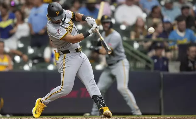 Pittsburgh Pirates' Nick Gonzales hits an RBI single during the fifth inning of a baseball game against the Milwaukee Brewers, Monday, June 23, 2025, in Milwaukee. (AP Photo/Aaron Gash)