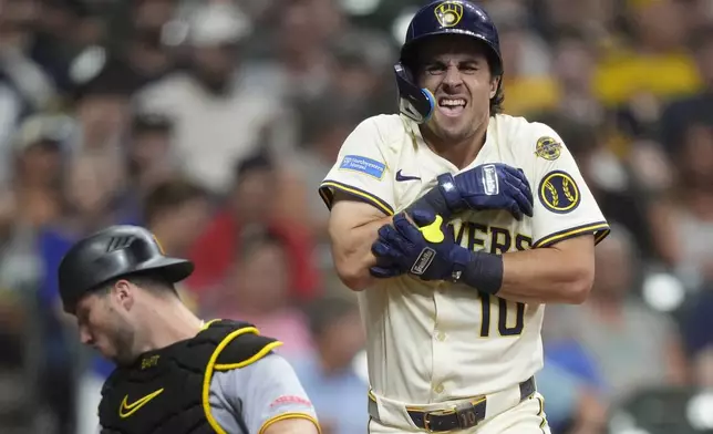 Milwaukee Brewers' Sal Frelick (10) reacts after being hit by a pitch during the fifth inning of a baseball game against the Pittsburgh Pirates, Monday, June 23, 2025, in Milwaukee. (AP Photo/Aaron Gash)