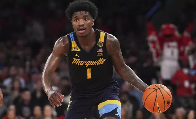FILE - Marquette's Kam Jones (1) looks to pass during the second half of an NCAA college basketball game against the St. John's in the semifinals of the Big East tournament, on March 14, 2025, in New York. (AP Photo/Frank Franklin II, File)