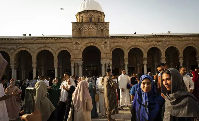 Muslims gather to perform Eid al-Adha prayers at Zaytuna Mosque in Tunis, Tunisia, Friday, June 6, 2025. (AP Photo/Anis Mili)