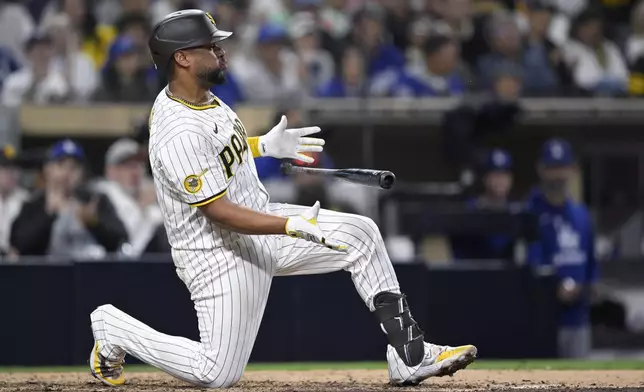 San Diego Padres' Elias Diaz reacts after striking out during the ninth inning of a baseball game against the Los Angeles Dodgers Monday, June 9, 2025, in San Diego. (AP Photo/Orlando Ramirez)