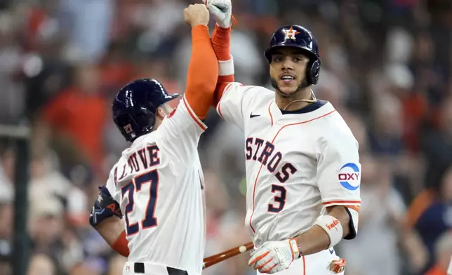 Houston Astros' Jeremy Pena (3) celebrates his two-run home run against the Tampa Bay Rays with Jose Altuve during the third inning of a baseball game, Saturday, May 31, 2025, in Houston. (AP Photo/Eric Christian Smith)