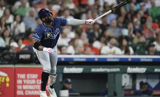 Tampa Bay Rays' Yandy watches his two-run home run against the Houston Astros during the third inning of a baseball game Saturday, May 31, 2025, in Houston. (AP Photo/Eric Christian Smith)