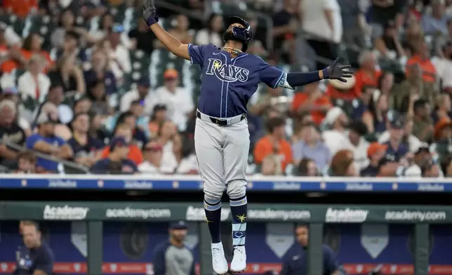 Tampa Bay Rays' Junior Caminero celebrates his solo home run against the Houston Astros during the fourth inning of a baseball game, Saturday, May 31, 2025, in Houston. (AP Photo/Eric Christian Smith)