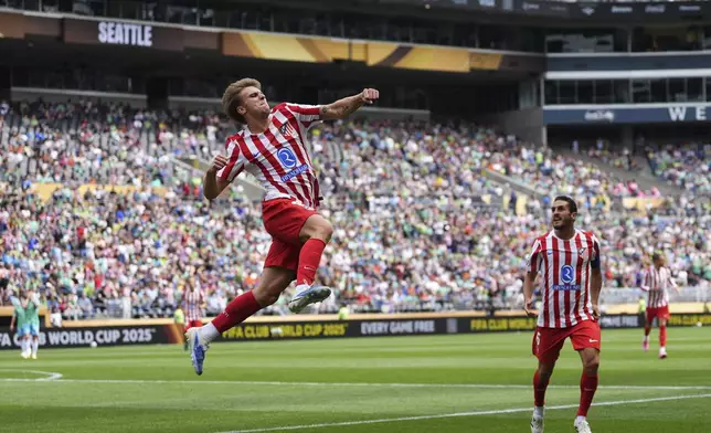 Atletico Madrid's Pablo Barrios celebrates scoring his side's opening goal during the Club World Cup group B soccer match between Seattle Sounders and Atletico Madrid in Seattle, Thursday, June 19, 2025. (AP Photo/Lindsey Wasson)