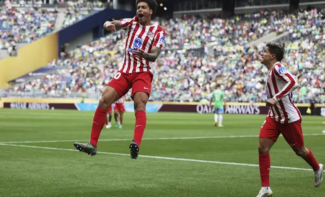 Atletico Madrid's Axel Witsel celebrates after scoring his team's second goal during the Club World Cup group B soccer match between Seattle Sounders and Atletico Madrid in Seattle, Thursday, June 19, 2025. (AP Photo/Ryan Sun)