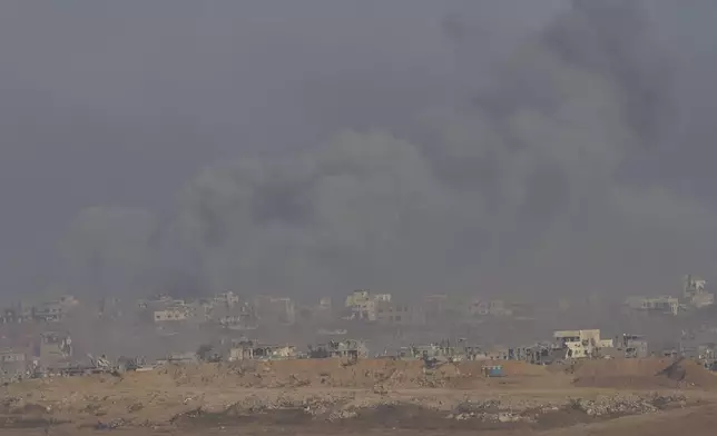 Smoke rises following an Israeli army bombardment in the Gaza Strip, seen from southern Israel, Sunday, June 1, 2025. (AP Photo/Ohad Zwigenberg)