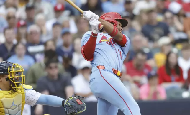 St. Louis Cardinals' Victor Scott II hits a two-RBI single against the Milwaukee Brewers during the third inning of a baseball game, Saturday, June, 14, 2025, in Milwaukee. (AP Photo/Jeffrey Phelps)