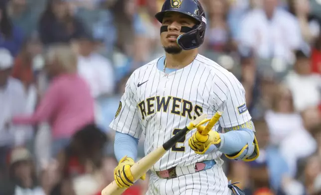 Milwaukee Brewers' William Contreras breaks his bat after striking out against the St. Louis Cardinals during the fourth inning of a baseball game, Saturday, June, 14, 2025, in Milwaukee. (AP Photo/Jeffrey Phelps)