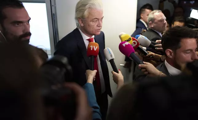 Far-right lawmaker Geert Wilders talks to the media after pulling his party out of the four-party Dutch coalition in The Hague, Netherlands, Tuesday, June 3, 2025. (AP Photo/Peter Dejong)