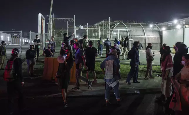 Protesters gather outside the Delaney Hall Detention Facility during protests over federal immigration enforcement raids on Thursday, June 12, 2025, in Newark, N.J. (AP Photo/Olga Fedorova)